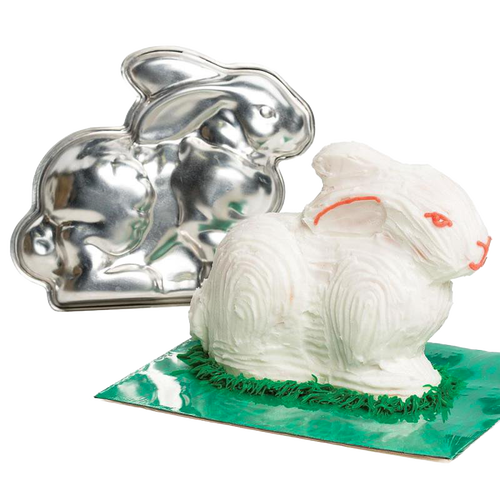 Shiny two-piece metal bunny cake pan alongside a decorated white bunny cake with orange accents, ideal for festive baking in Kitchen & Food, Cookware, USA Made, and Best Sellers collections.
