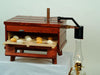 Handcrafted Amish-made wooden kerosene-powered egg incubator with eggs inside, designed for Farm, Garden & Tool, Animal Care, Chicken Accessories, USA Made, and Best Sellers collections.