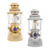 Two classic kerosene pressure lamps in beige and white finishes, featuring glass chimneys and brass details, designed for durable outdoor lighting in camping and emergency supplies collections.