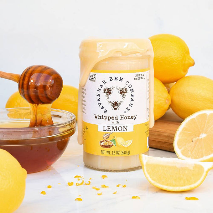 Handcrafted creamy whipped honey with lemon flavor in a glass jar surrounded by fresh lemons and honey dipper, ideal for Kitchen & Food, Pantry, and Best Sellers collections.