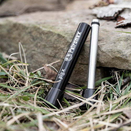 Durable and portable fire plunger with black metal casing and steel rod, designed for reliable ignition in camping, emergency supplies, and farm and garden tool collections.