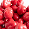 Close-up of glossy red chocolate covered cherries with a smooth candy coating, handcrafted and made in the USA, ideal for Kitchen & Food, Snacks and Sweets, Candy, and Best Sellers collections.
