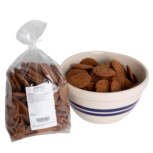 Two bags of handcrafted crispy ginger snap cookies, rich in warm spices and molasses, displayed beside a ceramic bowl with blue stripes, part of Kitchen & Food and USA Made collections.
