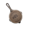 Handcrafted lightweight cast iron skillet with smooth surface, featuring a vintage wagon design embossed on the base, made in USA, ideal for Kitchen & Food, Camping, and Cast Iron collections.