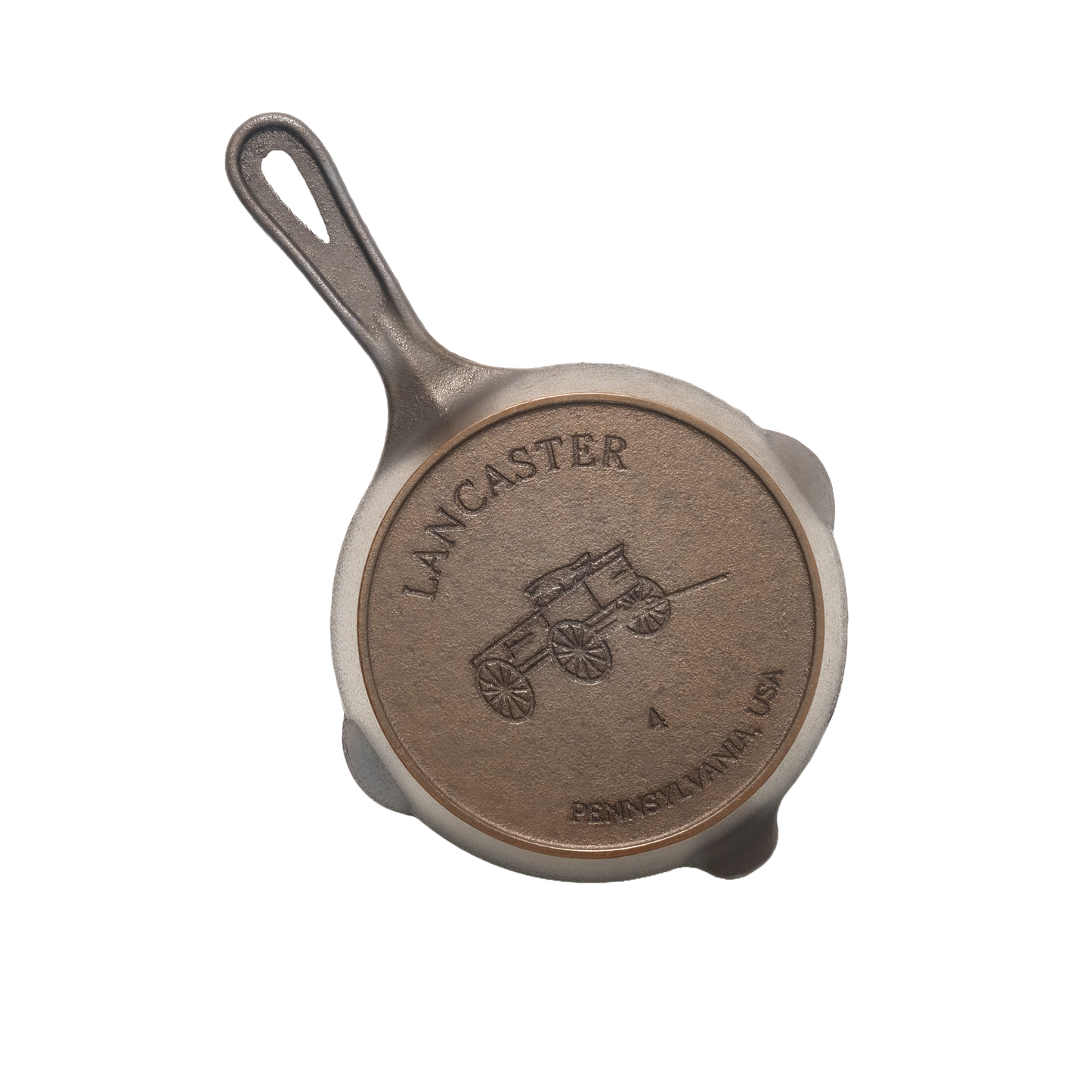 Handcrafted lightweight cast iron skillet with smooth surface, featuring a vintage wagon design embossed on the base, made in USA, ideal for Kitchen & Food, Camping, and Cast Iron collections.
