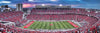 Panoramic view of a packed football stadium with fans dressed in red during sunset, captured from the skybox seat, featured in Toys, Books & Games and Best Sellers collections.