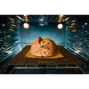 Rustic loaf baking on a dark heat-conductive steel surface in a well-lit oven, showcasing quality cookware ideal for Kitchen & Food, Baking Supplies, and Bread Making collections.