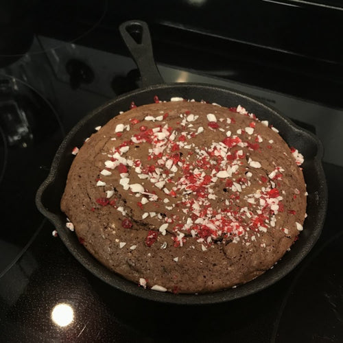 Handcrafted rich chocolate dessert baked in a black 6-inch cast iron skillet, sprinkled with crushed peppermint, ideal for Kitchen & Food, Dry Goods and Mixes, Best Sellers, Promo Eligible collections.