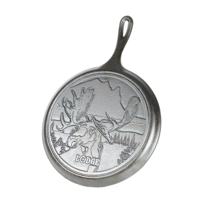 Cast iron griddle featuring a detailed bull moose design with Northwoods scenery, part of USA made cookware collections, perfect for Kitchen & Food and Best Sellers.