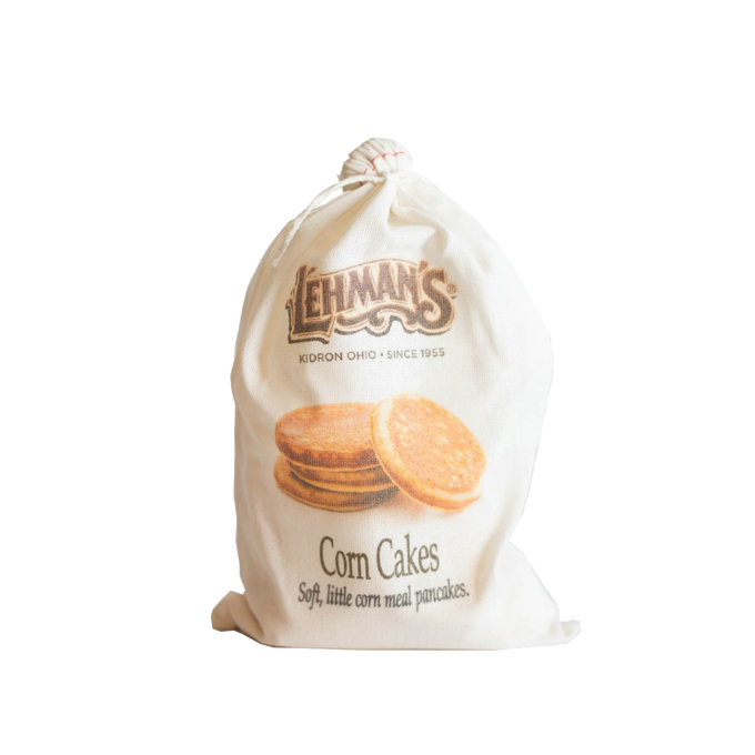 Natural fabric drawstring bag of handcrafted Lehman’s corn cakes mix, featuring rustic branding and illustration, ideal for Kitchen & Food, Pantry, Dry Goods and Mixes, Best Sellers, and Promo Eligible collections.