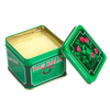 Open green metal tin of Bag Balm with creamy yellow balm inside, featuring vintage-style labeling with red flowers and leaf design, ideal for Health & Wellness and USA Made collections