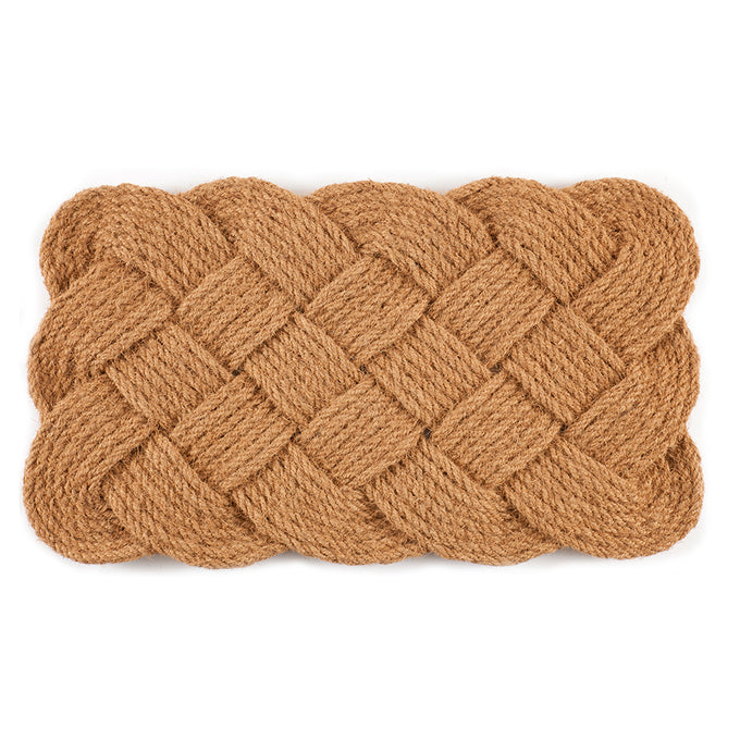 Handcrafted rectangular doormat woven from thick natural coconut fibers in a rustic braided pattern, featured in Home & Decor, Home Textiles, Best Sellers, and Promo Eligible collections.
