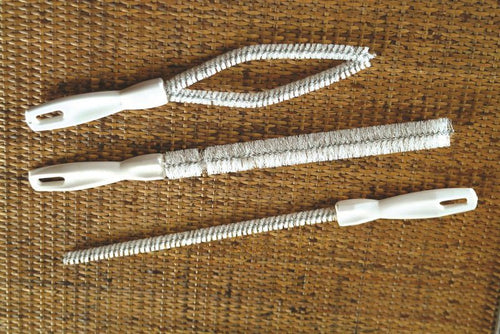 Set of three flexible nylon-bristle brushes with white handles crafted for cleaning curved spouts, perfect for household and kitchen use, made in USA, featured in Best Sellers and Cleaning Gadgets collections.