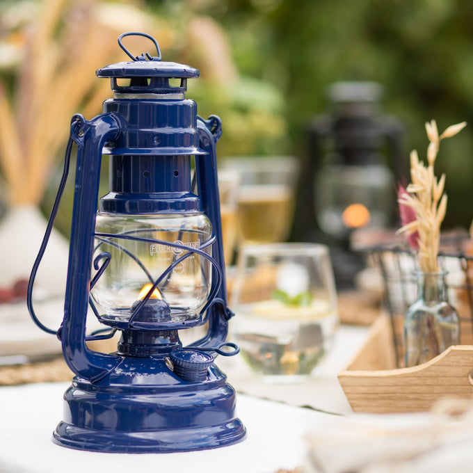 Handcrafted deep blue galvanized oil lantern with durable thermal heat-resistant SUPRAX globe, designed for lasting light in camping, emergency supplies, and outdoor settings.