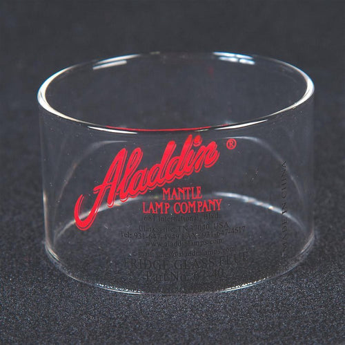 Clear cylindrical glass chimney with red and black vintage-style Aladdin Mantle Lamp Company branding, suitable for appliance and heating collections.