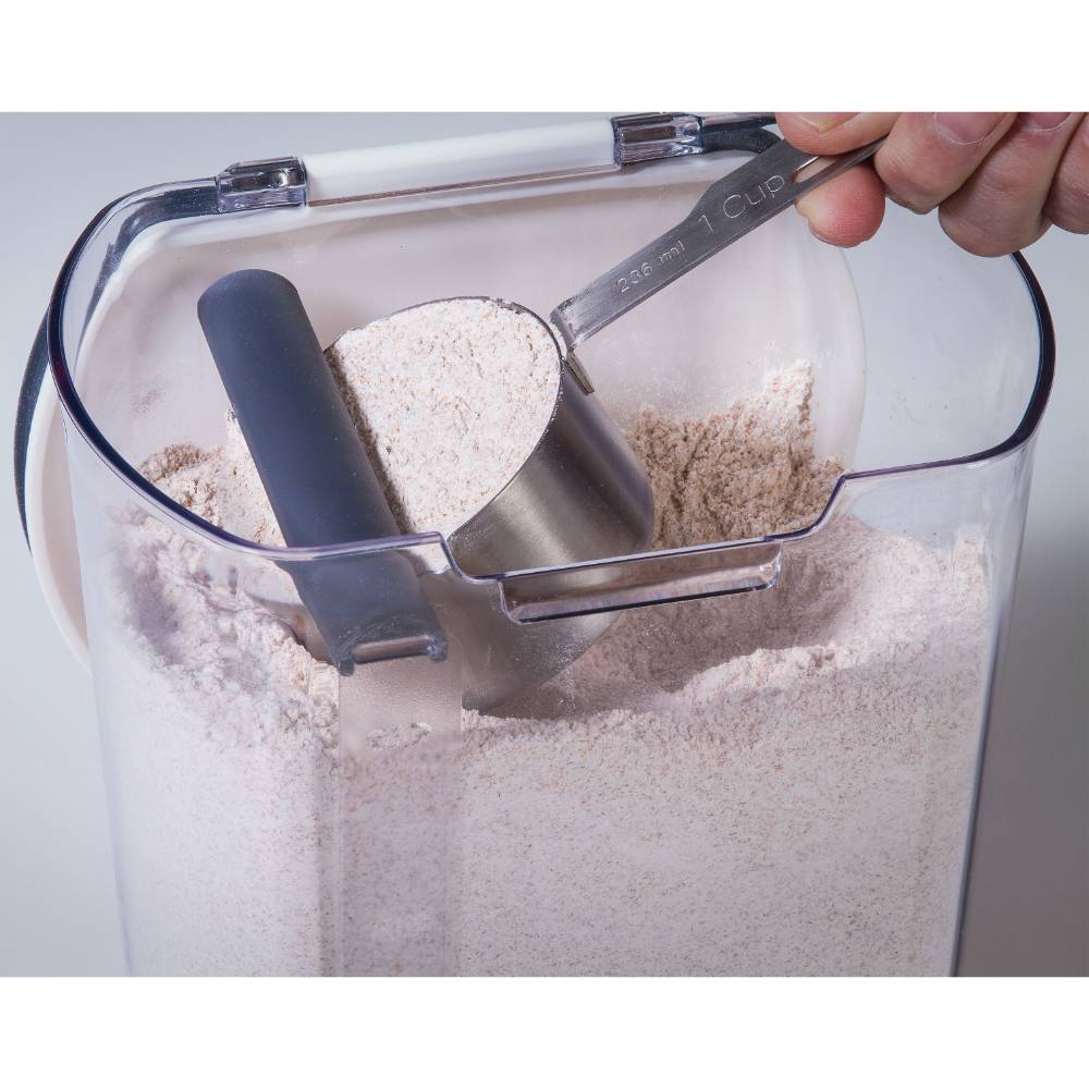 Clear plastic storage container holding flour with built-in leveler and a metal 1-cup measuring scoop, designed for freshness and organization in Kitchen & Food, Storage and Serving, Best Sellers, Promo Eligible collections.