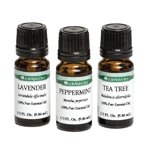 Three amber glass bottles with black caps containing 100% pure essential oils in lavender, peppermint, and tea tree scents, crafted for Health & Wellness collections.