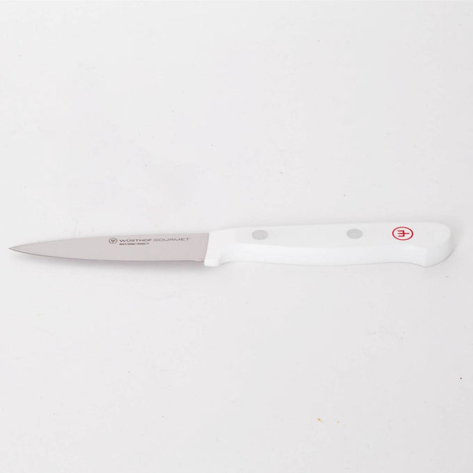 Slim paring knife with a sharp stainless steel blade and ergonomic white handle featuring rivet accents, designed for precision food prep in Kitchen & Food and Food Prep collections.