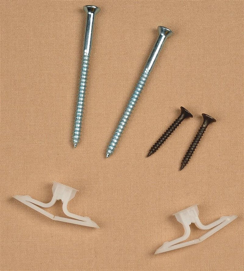 Two long silver screws, two shorter black screws, and two white plastic toggle anchors arranged on a beige background, suitable for home décor and laundry supply use.