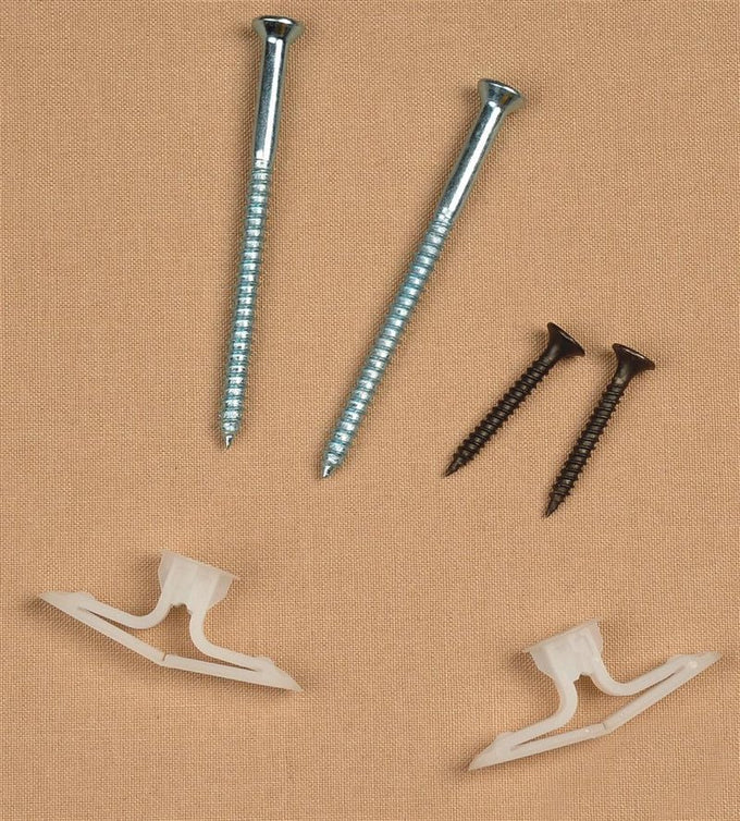 Two long silver screws, two shorter black screws, and two white plastic toggle anchors arranged on a beige background, suitable for home décor and laundry supply use.