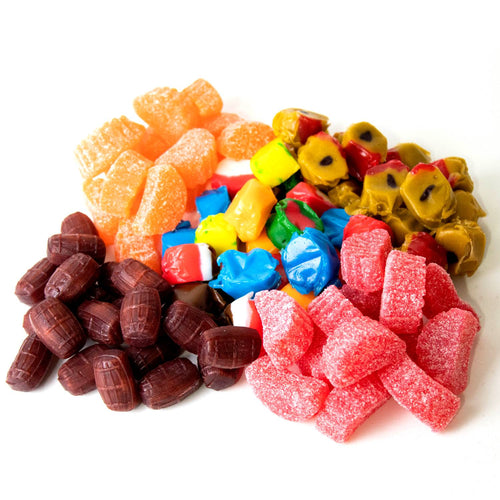 Assortment of colorful nostalgic candies including fruit slices and barrel-shaped chews, evoking sweet memories from classic snack collections in Kitchen & Food, Snacks and Sweets.