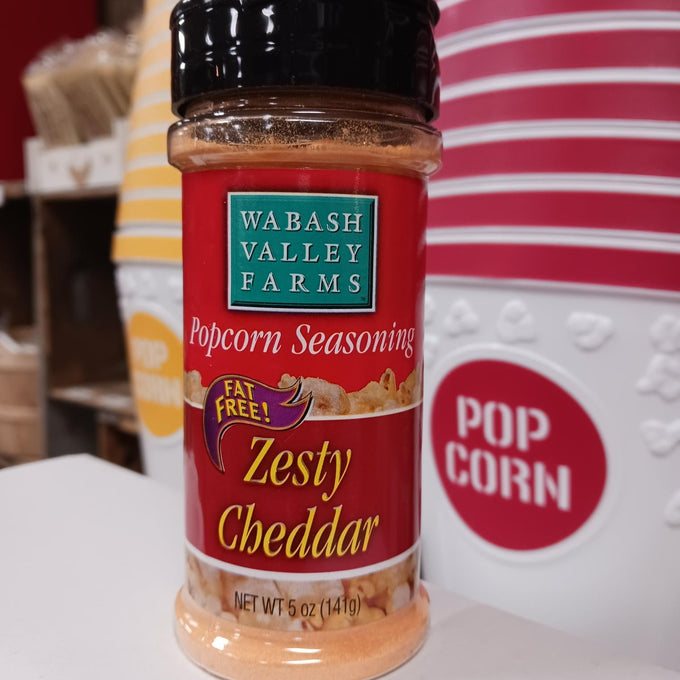 Bottle of fat-free Zesty Cheddar popcorn seasoning from Wabash Valley Farms, part of Kitchen & Food and USA Made collections, enhancing savory popcorn flavors.