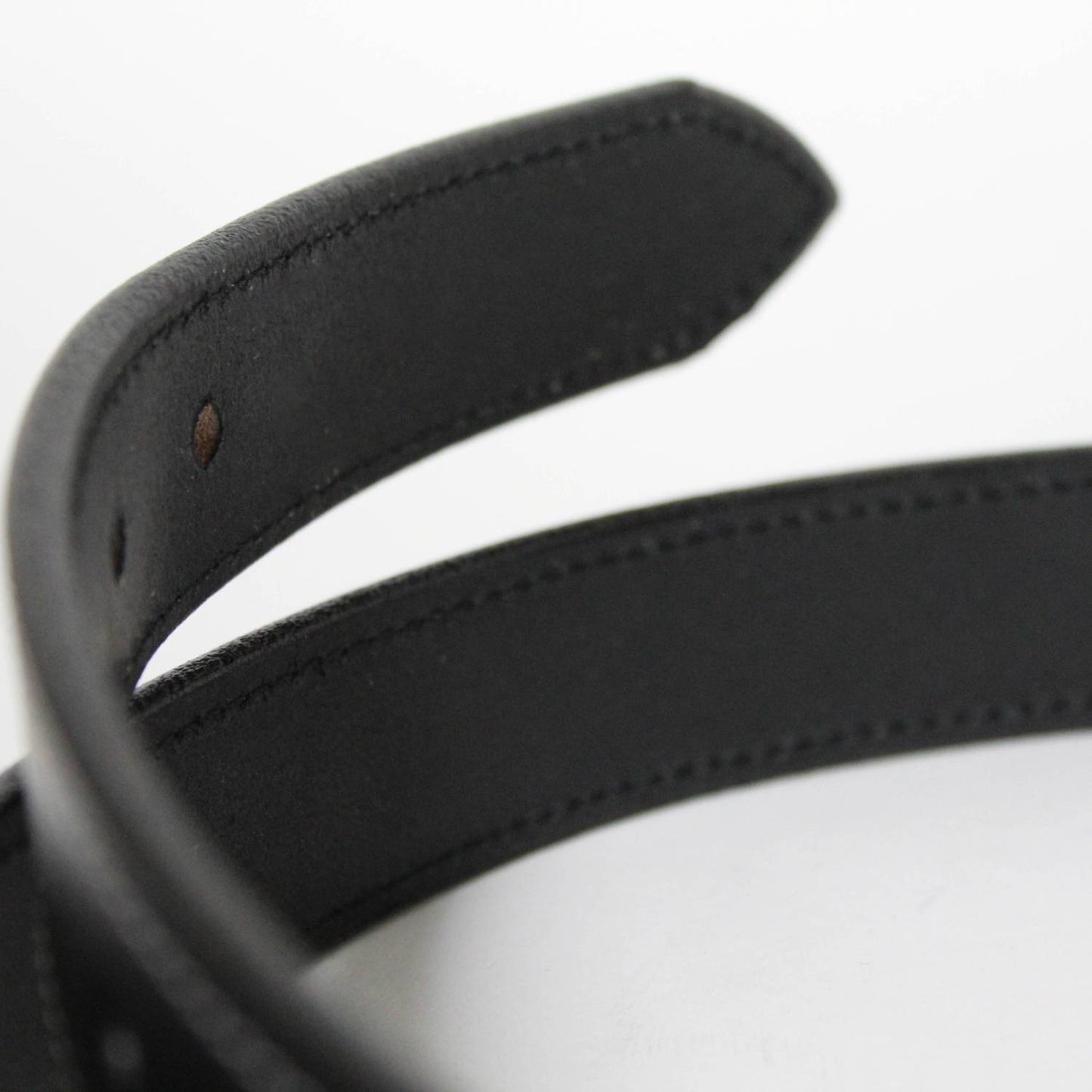 Close-up of a handcrafted black genuine English bridle leather belt featuring precise stitching and punched adjustment holes, Amish made in USA, part of Clothing and Accessories and Best Sellers collections.