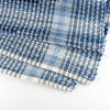 Close-up of a handcrafted woven denim rug with a textured blue pattern and finished edge, made in the USA, featured in Home & Decor and Best Sellers collections.