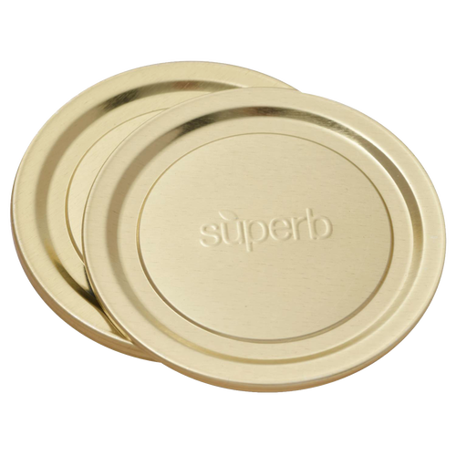 Two wide-mouth metal canning jar lids with embossed "superb" logo, designed for secure sealing, featured in food preservation and kitchen collections, made in USA.