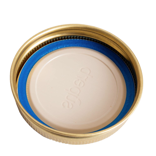 Set of twelve gold-tone metal canning jar bands paired with white lids featuring a blue sealing gasket, crafted in USA and ideal for kitchen, food preservation, and canning collections.