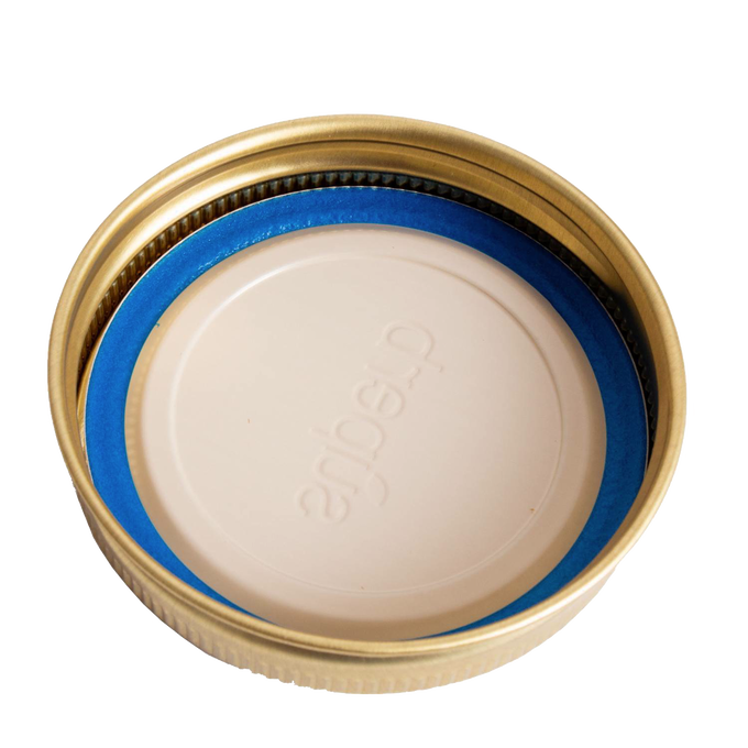 Set of twelve gold-tone metal canning jar bands paired with white lids featuring a blue sealing gasket, crafted in USA and ideal for kitchen, food preservation, and canning collections.