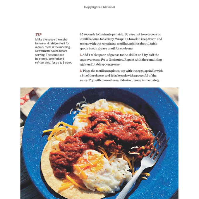 Close-up of a plated breakfast dish with eggs, shredded cheese, and red sauce on corn tortillas, featured in the Best Sellers and Cookbooks collections suitable for Toys, Books & Games.