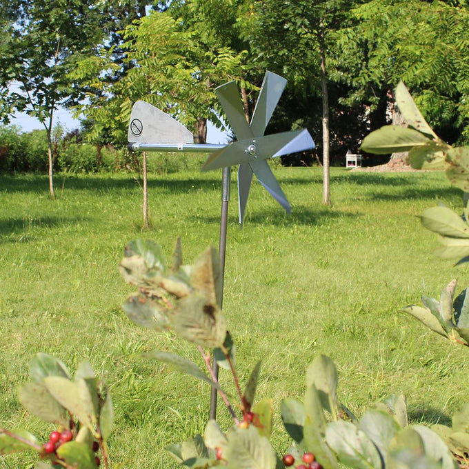 Handcrafted Amish made mole deterrent windmill with shiny metal blades mounted on a slender post, designed for humane pest control in Farm, Garden & Tool, Lawncare, Pest Control, Best Sellers, and Promo Eligible collections.