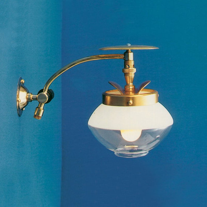 Handcrafted wall-mounted brass gas light with clear glass globe and adjustable arm, designed for long-lasting performance in Lamps & Lighting, Gas Lights, Best Sellers, and Promo Eligible collections.