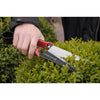 Person using lightweight Spear & Jackson topiary shears with high carbon steel blades to trim green shrub, ideal for precise garden maintenance in Farm, Garden & Tool and Lawncare collections.