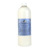 Tall translucent bottle of lavender-scented fabric softener with a blue label featuring a farmhouse illustration, part of USA made laundry supplies and best sellers collections.