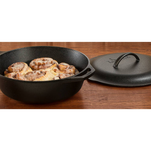 Extra deep cast iron chicken fryer with skillet-style handle and separate lid featuring self-basting nubs, shown with freshly baked cinnamon rolls for versatile Kitchen & Food use.