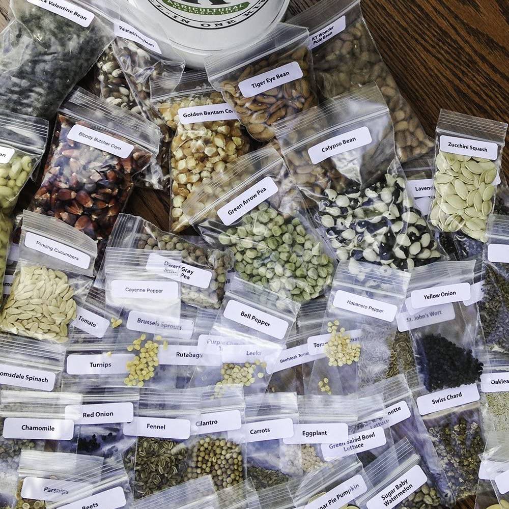 Collection of assorted heirloom seeds in clear labeled bags, including beans, peas, peppers, squash, and herbs, ideal for farm, garden & tool, seeds and planting, and USA made collections.