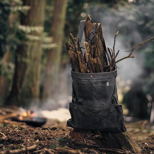 Weather- and water-resistant charcoal harvesting bag with convertible straps, filled with gathered sticks, ideal for Farm, Garden & Tool and Apple Harvest Supplies collections.