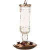Clear vintage-style glass hummingbird feeder with embossed bottle, brushed copper base, flower-shaped feeding ports, hanging metal hook, ideal for Farm, Garden & Tool and Animal Care collections.