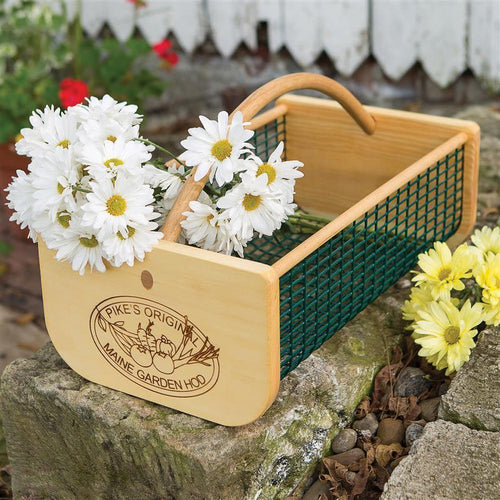 Handcrafted Maine Garden Hod featuring smooth wooden ends with engraved logo and curved wooden handle, green wire mesh body, holding white daisies, part of Farm, Garden & Tool, Garden Accessories, USA Made, Best Sellers, and Promo Eligible collections.