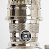 Close-up of a polished metal wick adjustment knob on a handcrafted vintage-style oil lamp, designed for Lamps & Lighting, Oil Lamps, Table Lamps, and Best Sellers collections.