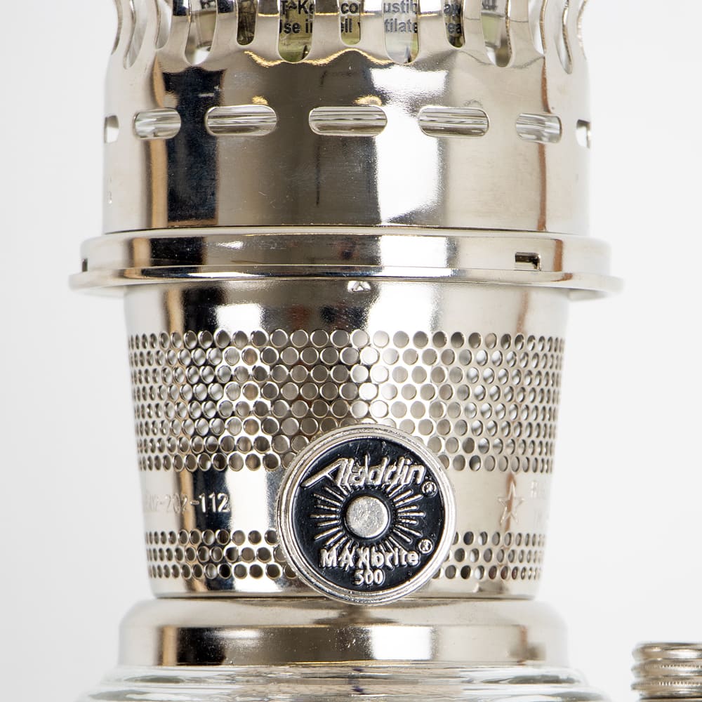 Close-up of a polished metal wick adjustment knob on a handcrafted vintage-style oil lamp, designed for Lamps & Lighting, Oil Lamps, Table Lamps, and Best Sellers collections.