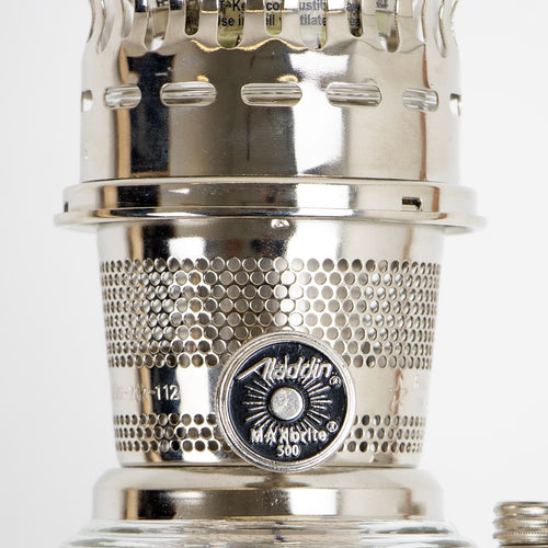 Close-up of a polished metal wick adjustment knob on a handcrafted vintage-style oil lamp, designed for Lamps & Lighting, Oil Lamps, Table Lamps, and Best Sellers collections.