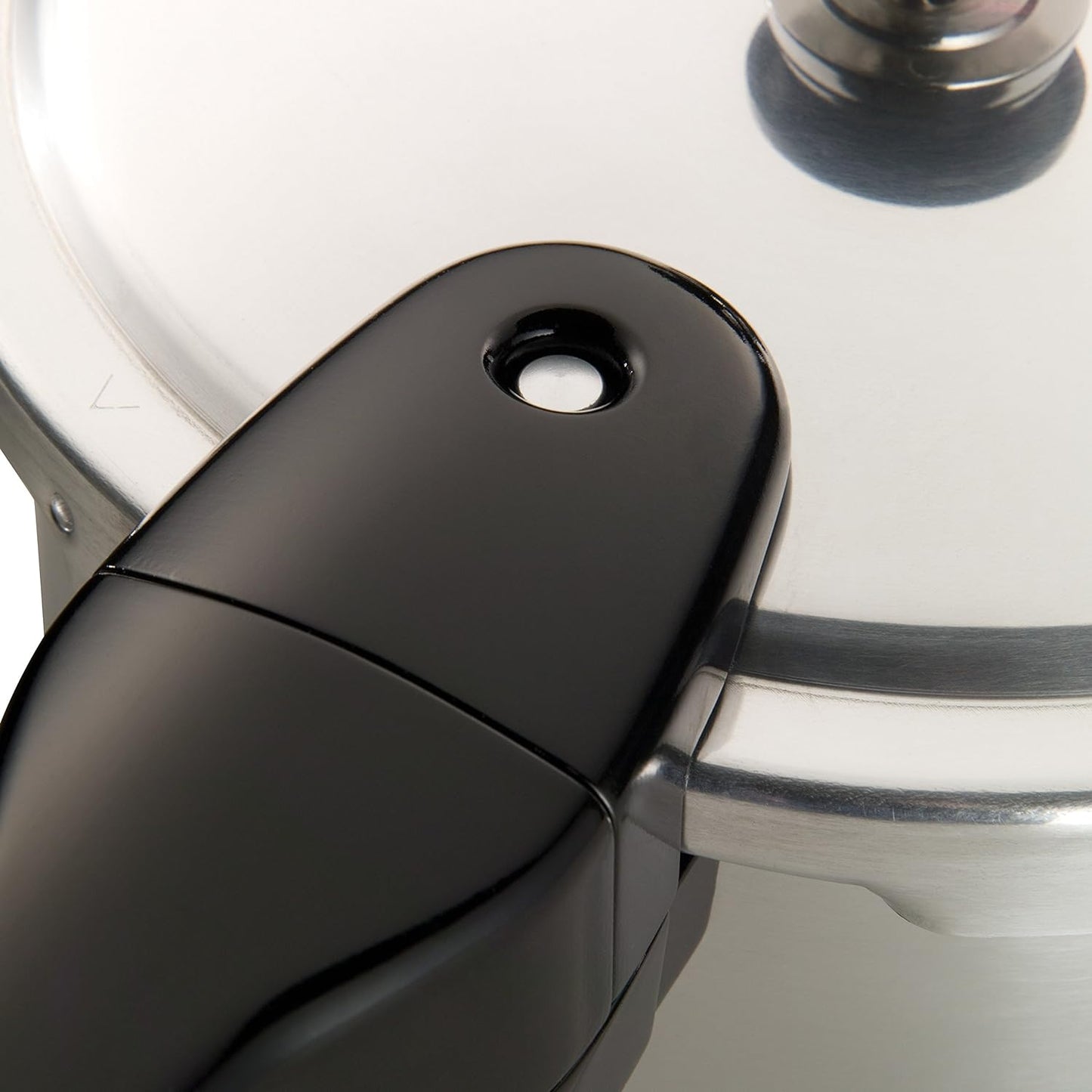 Close-up of a handcrafted aluminum pressure cooker lid with polished finish and black ergonomic handle, featured in Kitchen & Food, Cookware, Pots and Pans, Best Sellers, and Promo Eligible collections.