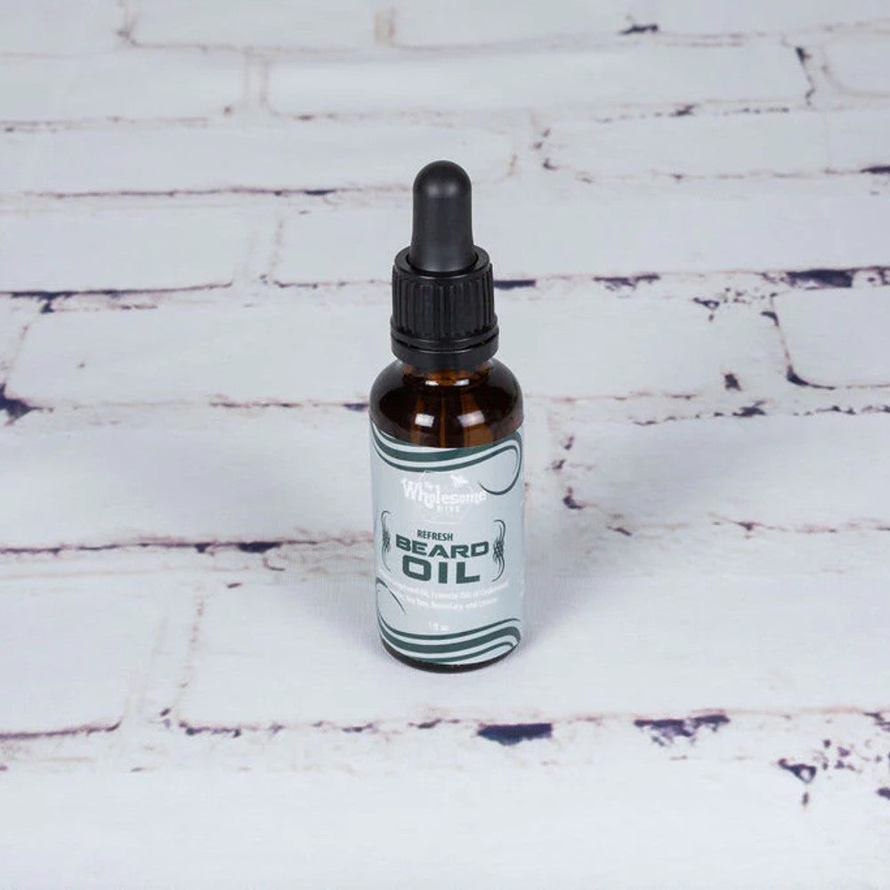 Handcrafted amber glass bottle of locally-made beard oil with dropper, featuring all-natural grapeseed and essential oils, ideal for Health & Wellness, Grooming, USA Made, and Best Sellers collections.