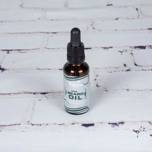 Handcrafted amber glass bottle of locally-made beard oil with dropper, featuring all-natural grapeseed and essential oils, ideal for Health & Wellness, Grooming, USA Made, and Best Sellers collections.