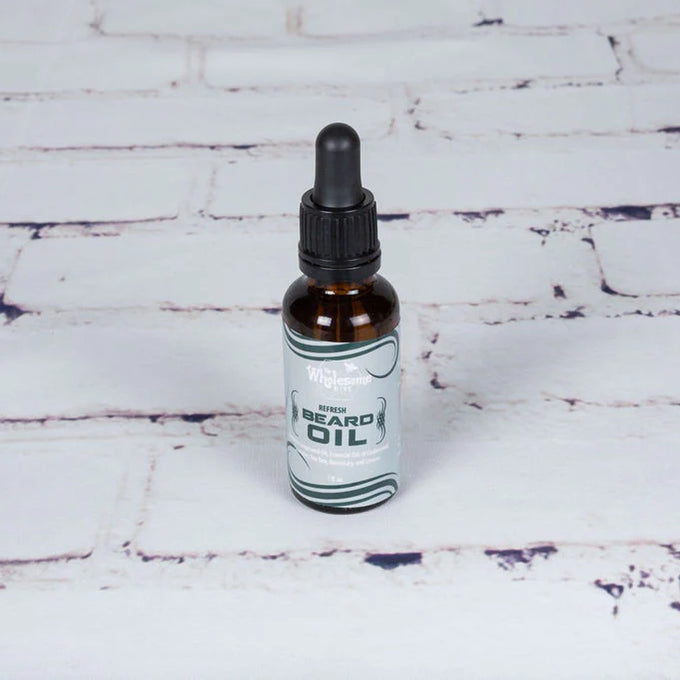 Handcrafted amber glass bottle of locally-made beard oil with dropper, featuring all-natural grapeseed and essential oils, ideal for Health & Wellness, Grooming, USA Made, and Best Sellers collections.