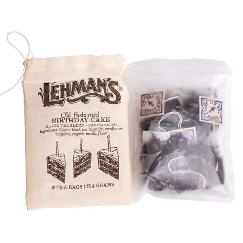 Cloth bag with vintage-style print and a clear resealable pouch holding handcrafted tea bags featuring a birthday cake flavored black tea blend, part of USA Made and Best Sellers collections.