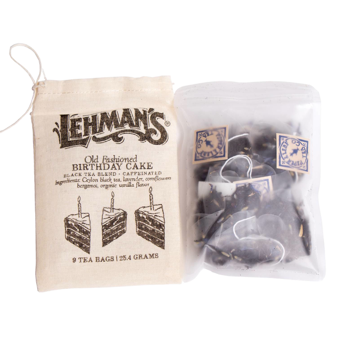 Cloth bag with vintage-style print and a clear resealable pouch holding handcrafted tea bags featuring a birthday cake flavored black tea blend, part of USA Made and Best Sellers collections.